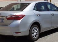 Silver Toyota Camry sedan parked on a city street, rear and side view showing license plate 1GCW-536 (Western Australia).